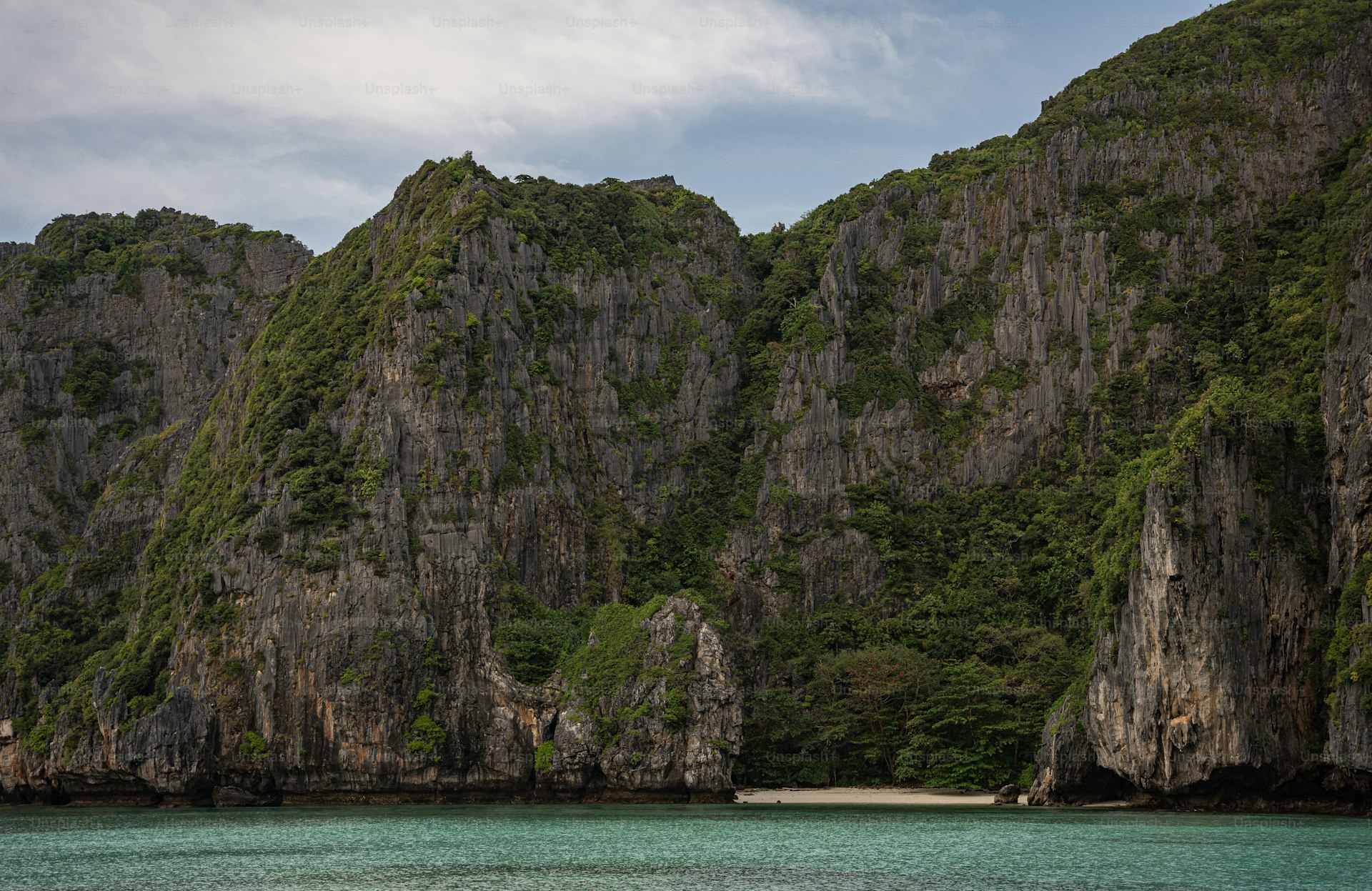 Thailand beach turquoise water and longtail boats