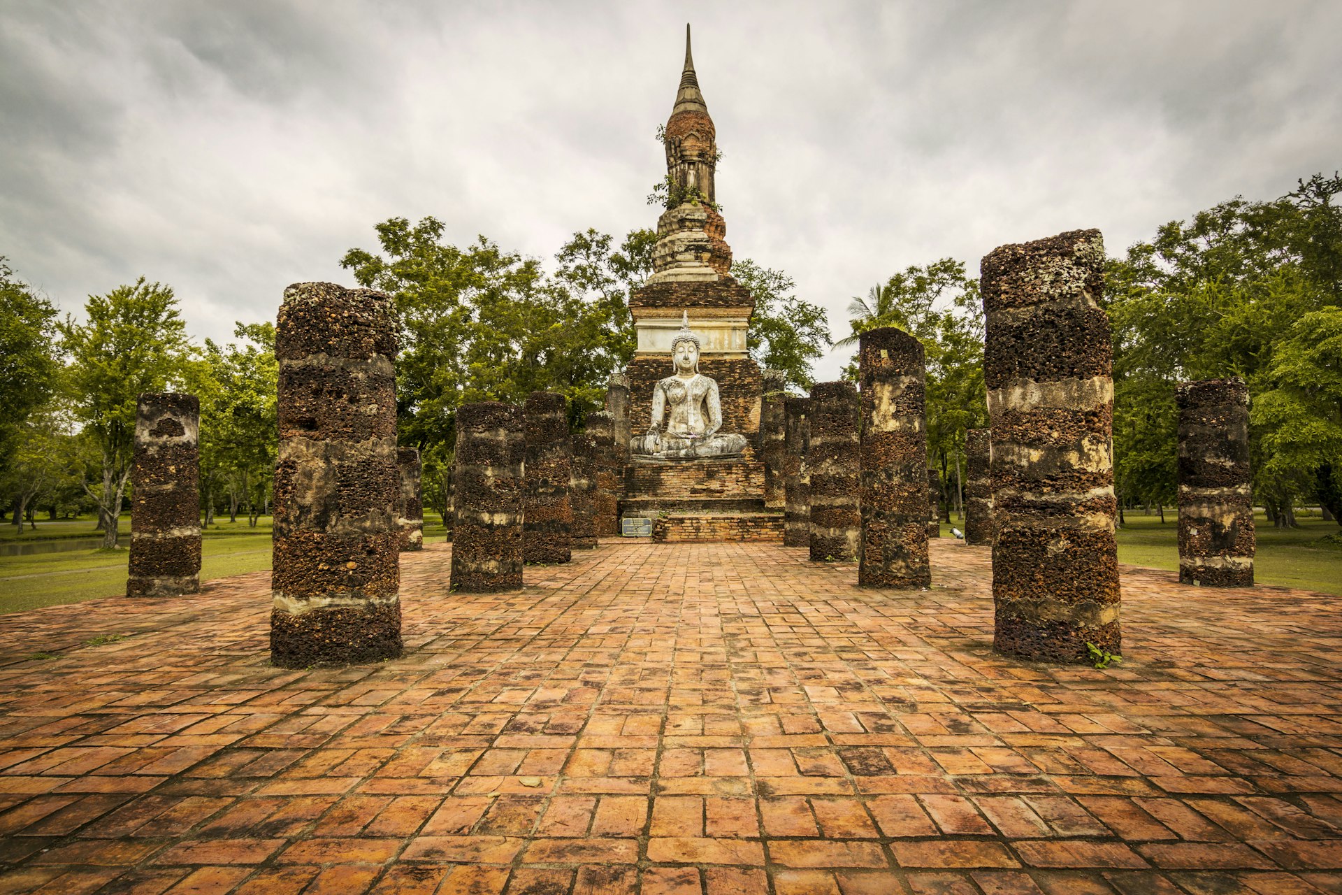 Sukhothai ancient temple ruins at sunset
