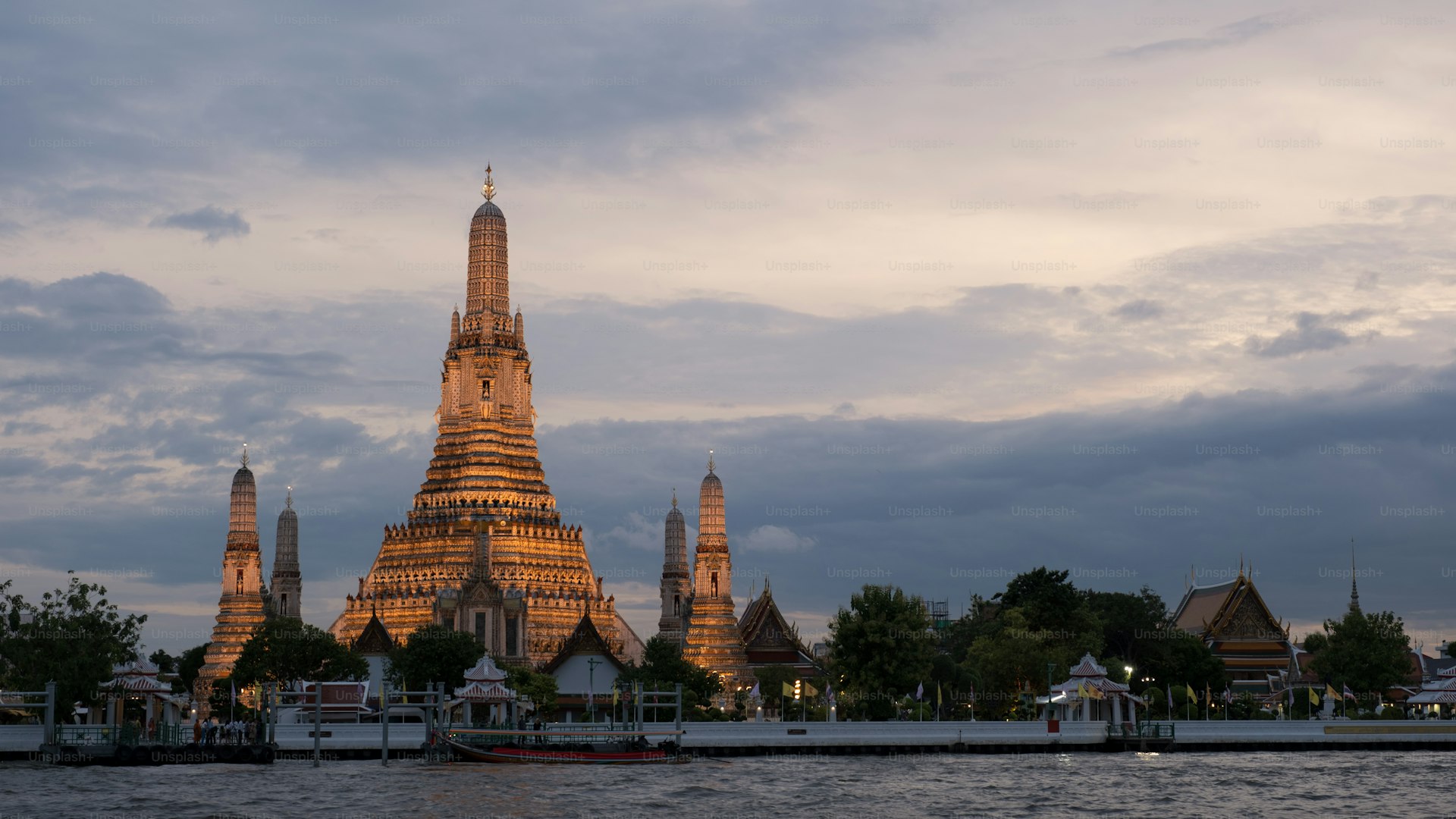 Wat Arun temple Bangkok golden spires at twilight